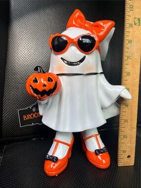 Brookstone White Ghost Figurine with Orange Accessories and Black Details